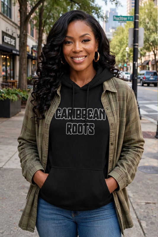 Black woman wearing black Caribbean Roots hoodie with black fill grey outline flat embroidery, walking on Peachtree Street Atlanta, relaxed unisex mid-weight hoodie size M, long length